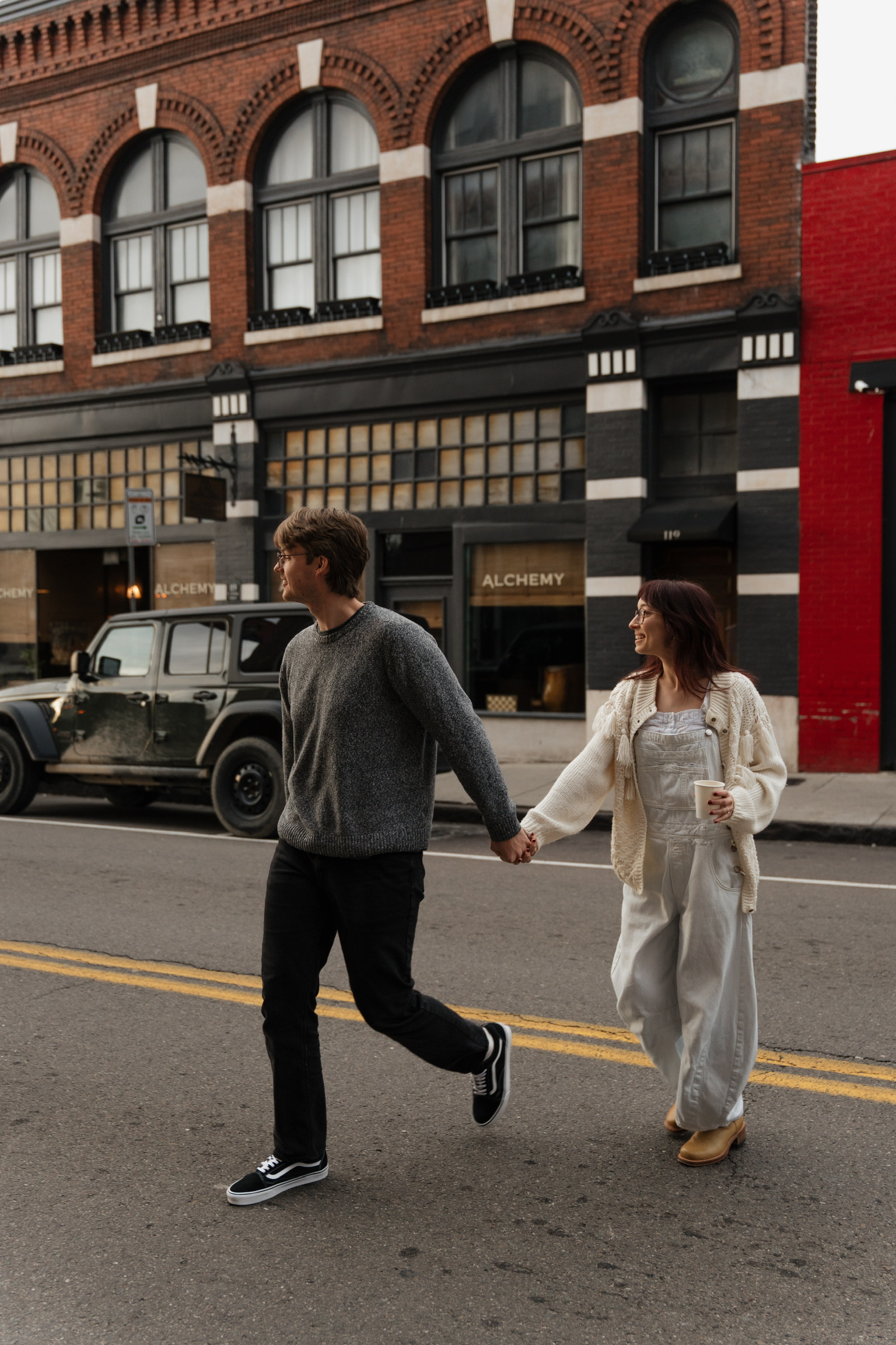 The bride and groom cross the street symbollically.